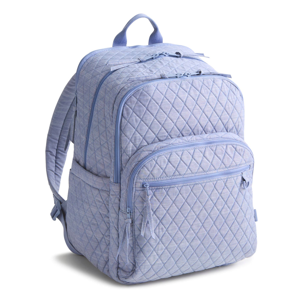 Quilted light blue backpack on a white background