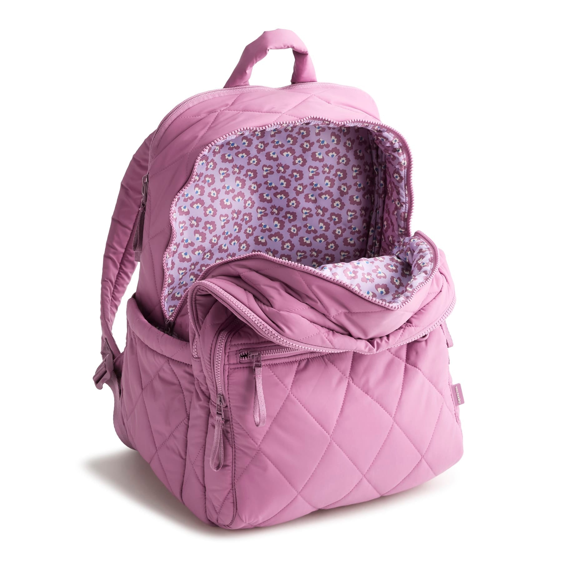 Pink quilted backpack with floral lining on a white background
