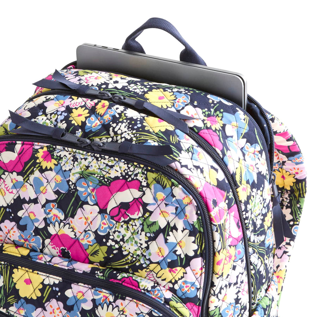 Floral patterned backpack with a laptop compartment on a white background
