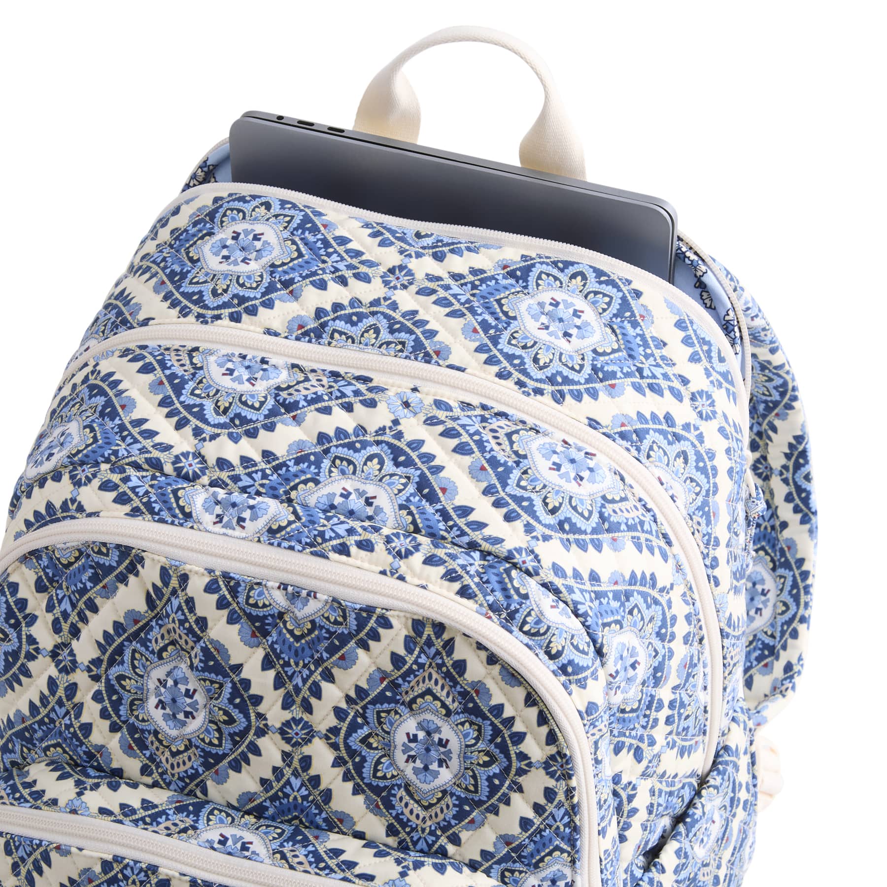 Blue and white patterned backpack with a laptop compartment on a white background