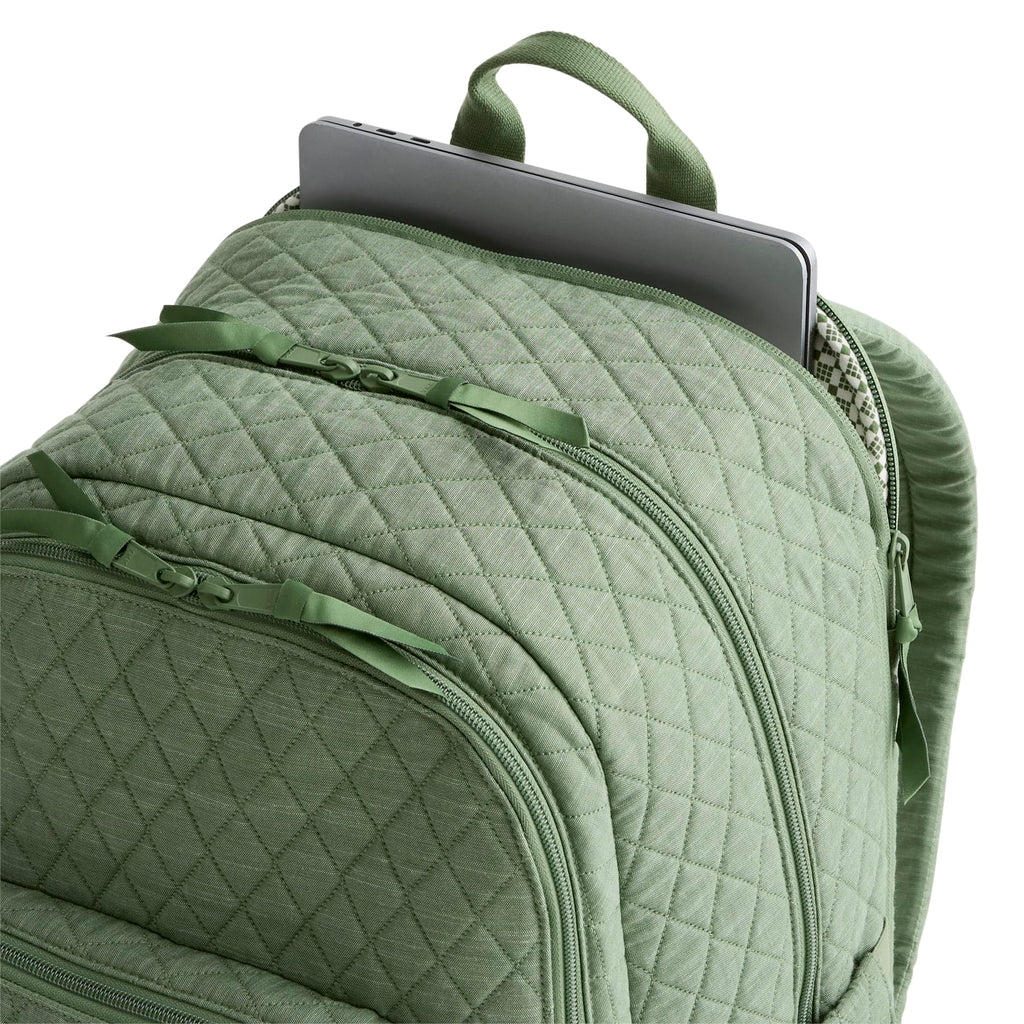 Green quilted backpack with a laptop compartment on a white background