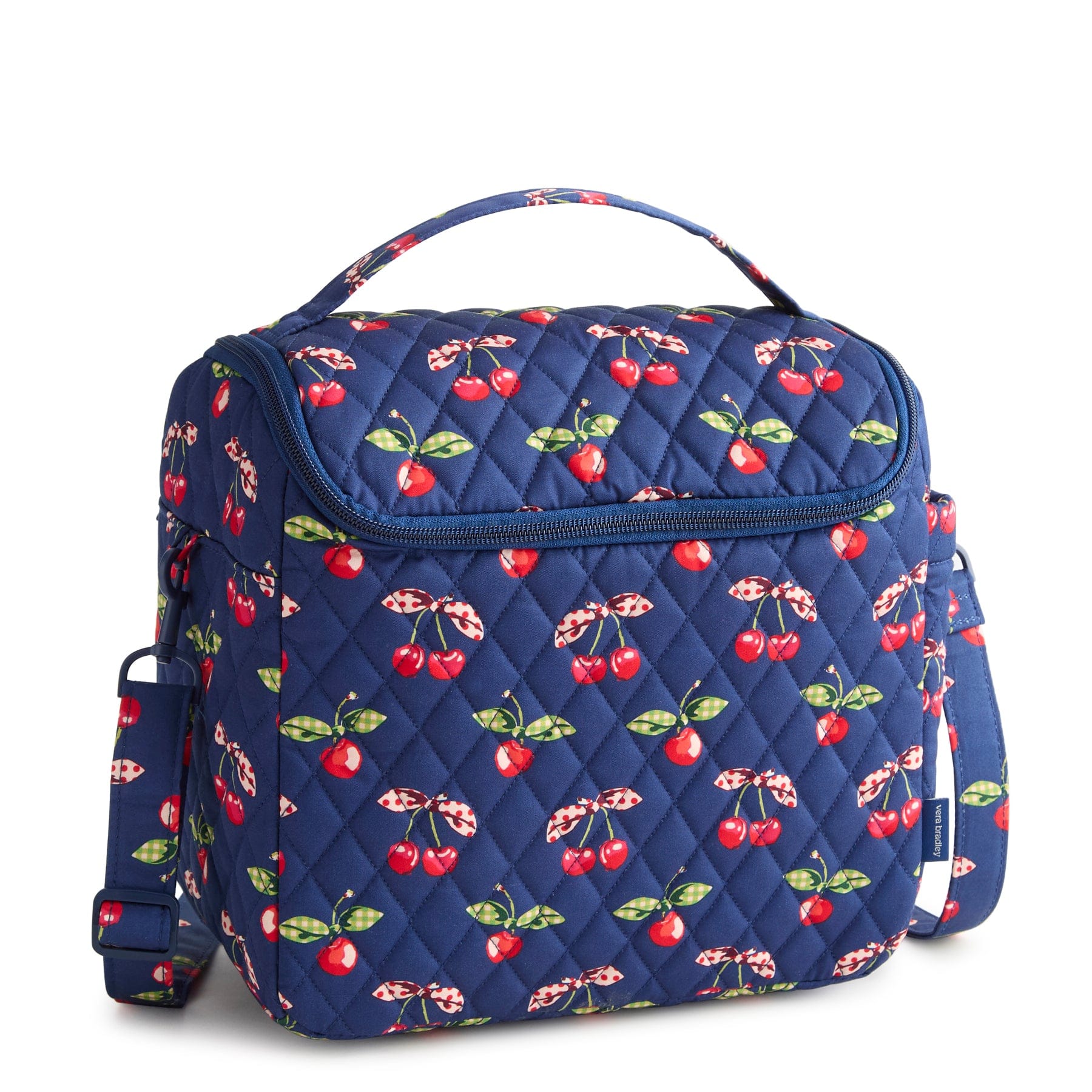 Blue quilted bag with cherry pattern on a white background