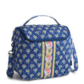 Blue floral-patterned bag with a colorful stripe on a white background