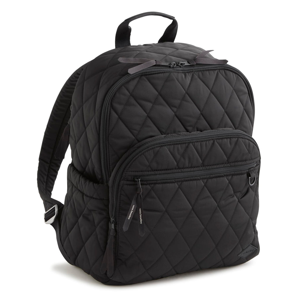 Black quilted backpack on a white background
