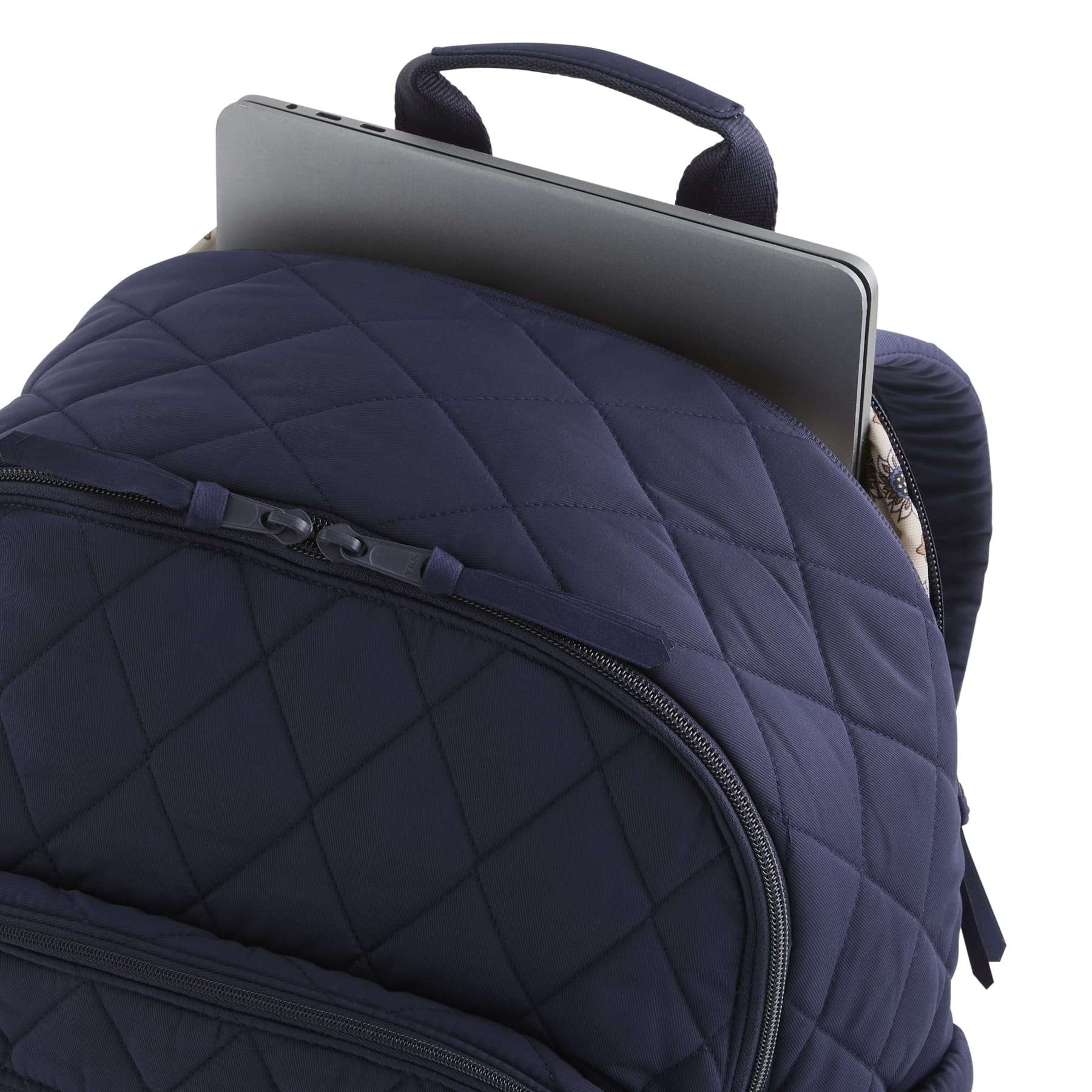 Navy blue quilted backpack with a laptop compartment on a white background